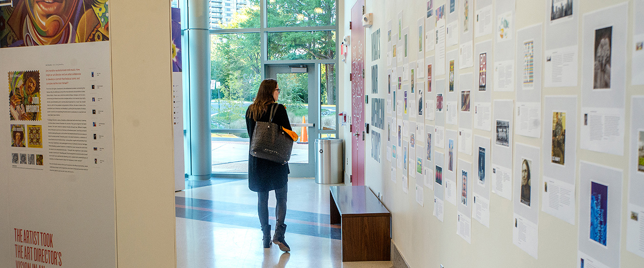 a student viewing art in a gallery