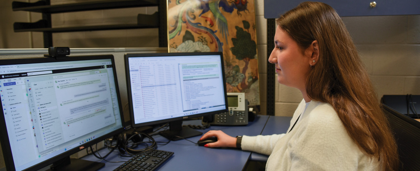 NOVA Staff member working on computer