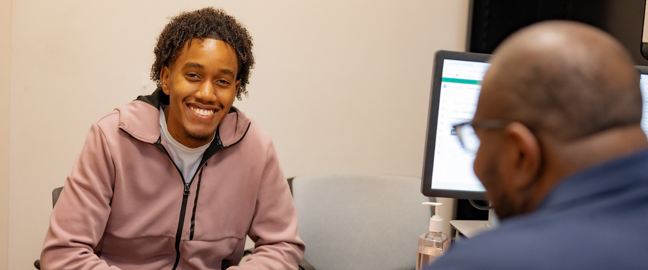 student speaking to advisor