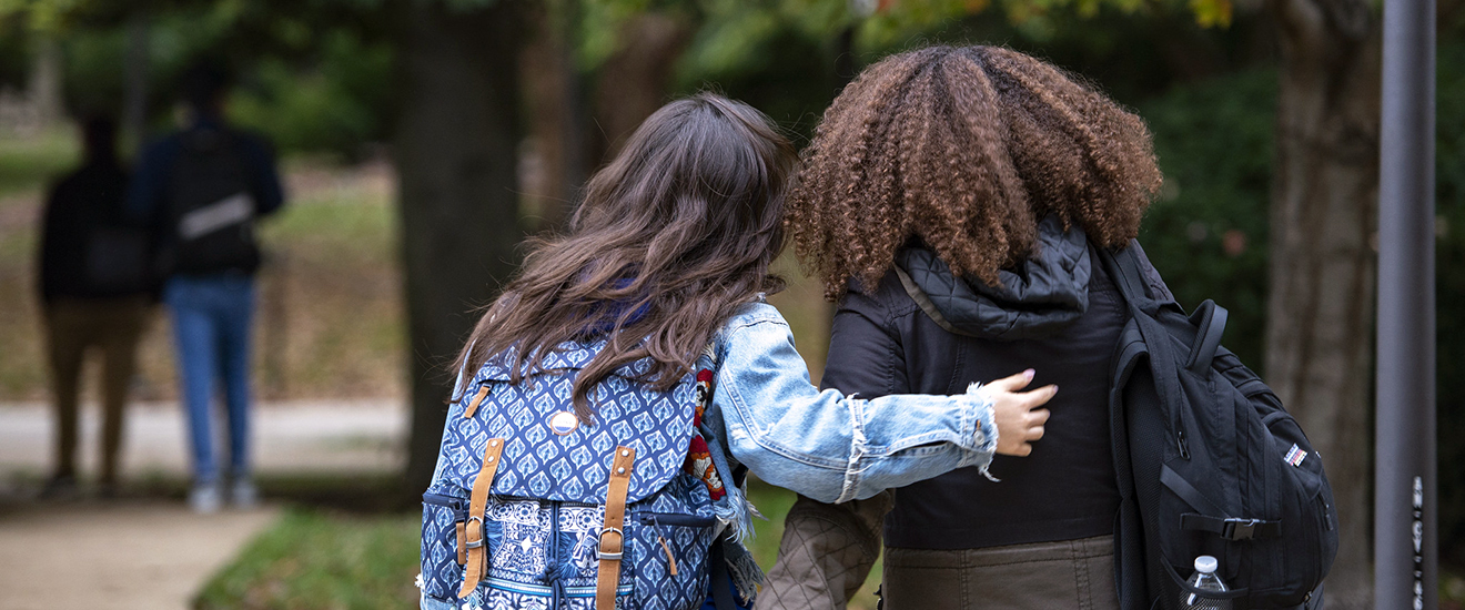 two students walking on campus