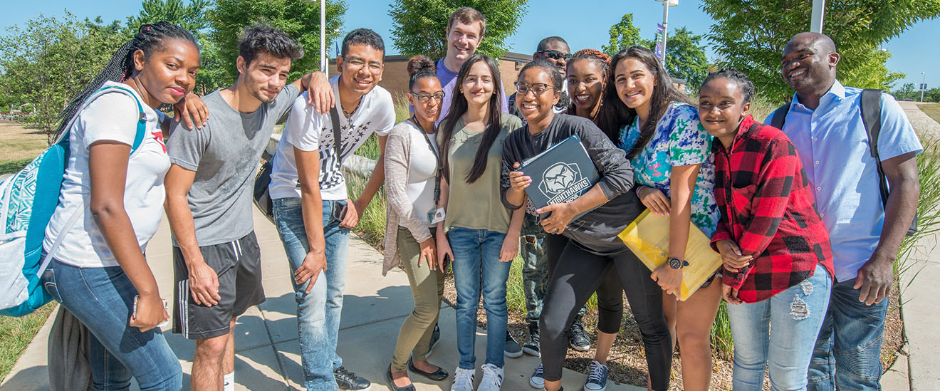 students gathered together smiling