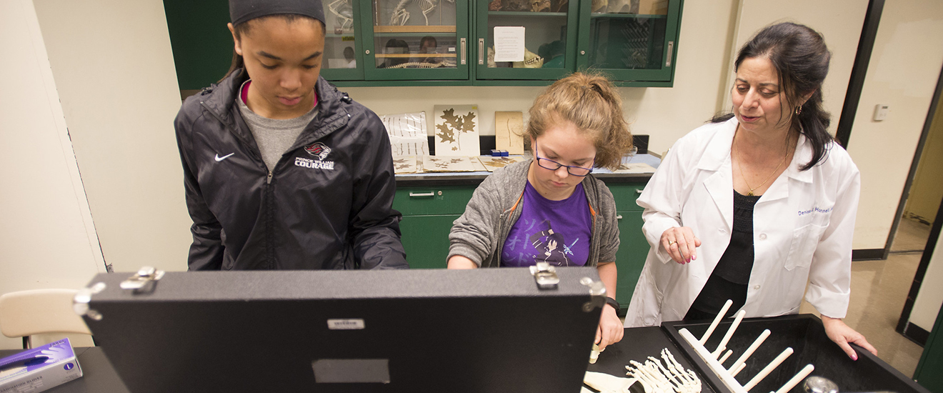 high school students working with a NOVA instructor