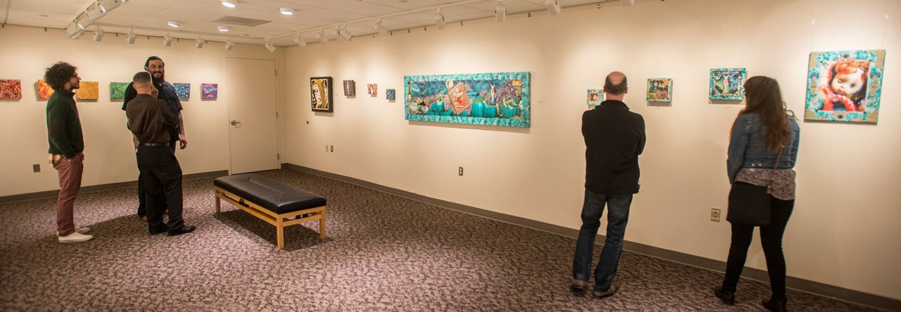 People viewing artwork at the Fisher Gallery