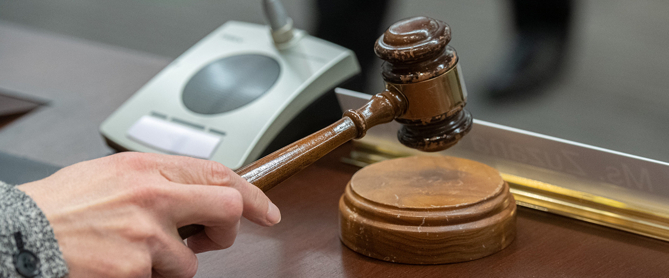 a board member reaching for the gavel