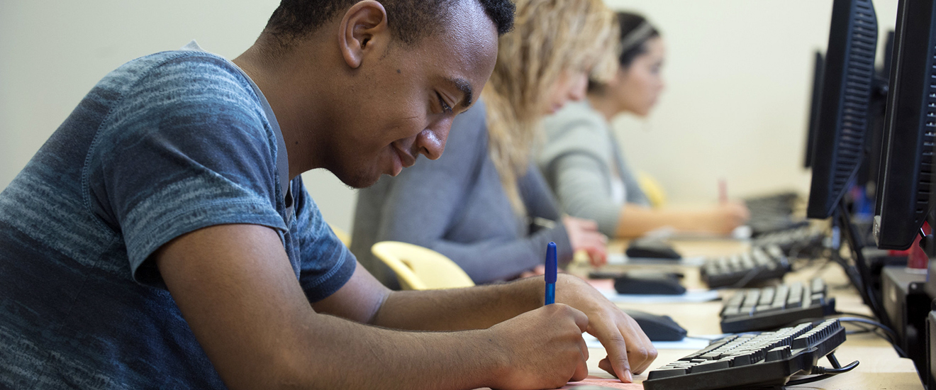 student working at a computer