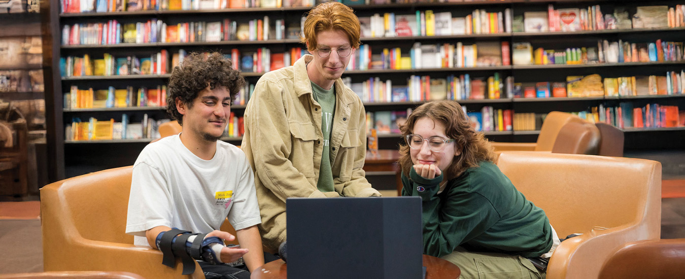 Students looking at a laptop