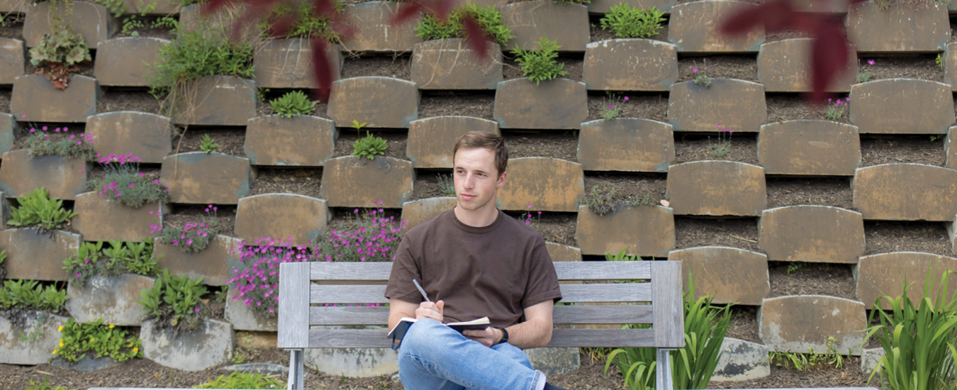 Student sitting on a bench