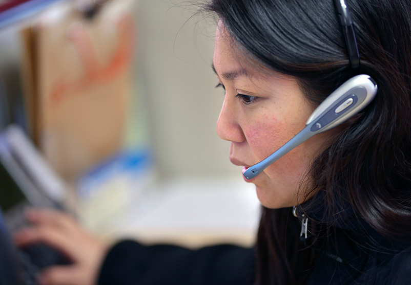 A staff member wearing a headset