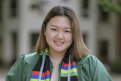 Hannah Choi, smiling and standing outdoors.