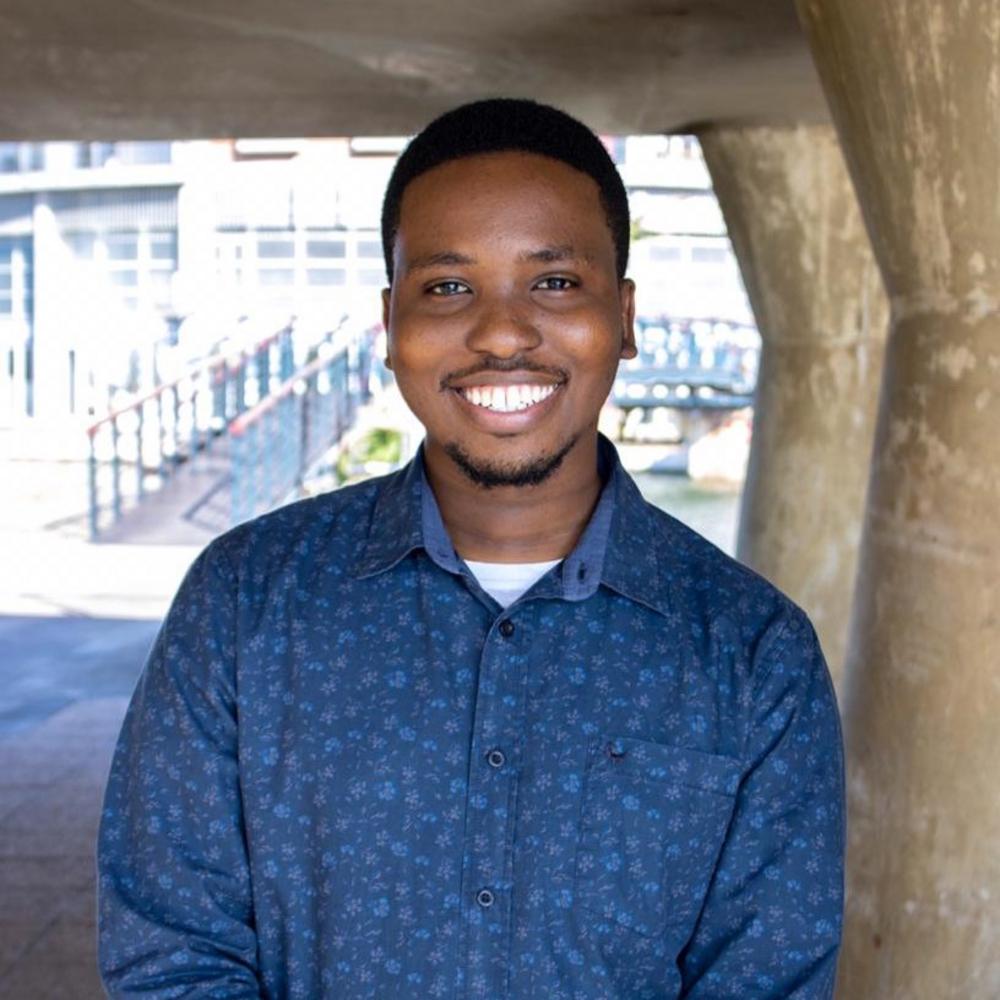 Gomolemo Mohapi smiling outdoors, showcasing his journey from NOVA student to Microsoft employee.