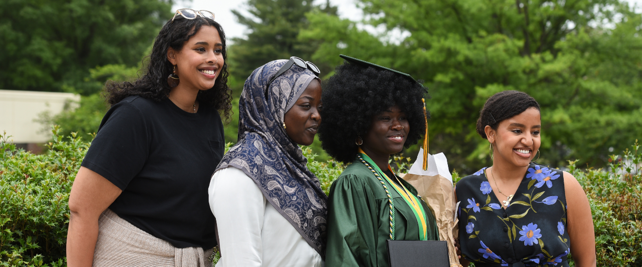 graduating student with family on campus