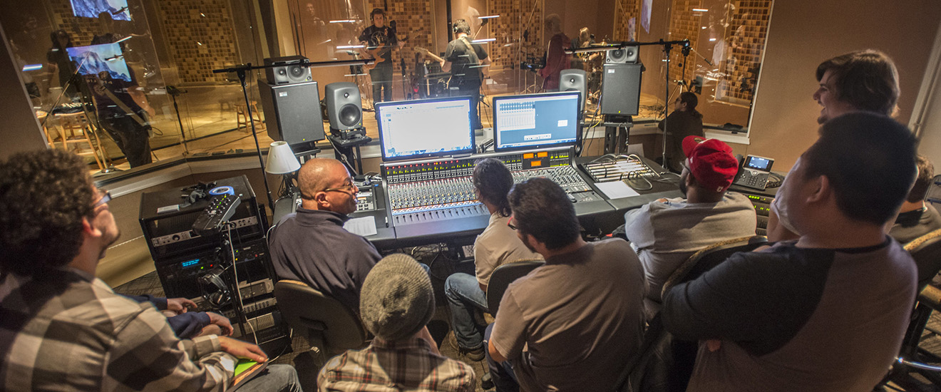 Students and instructors in a recording studio
