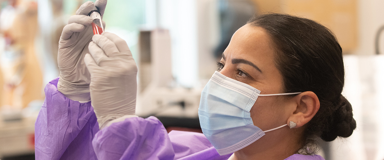 A student analyzing a blood sample