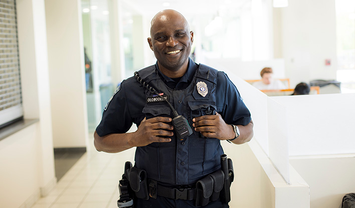 NOVA police officer smiling indoors.