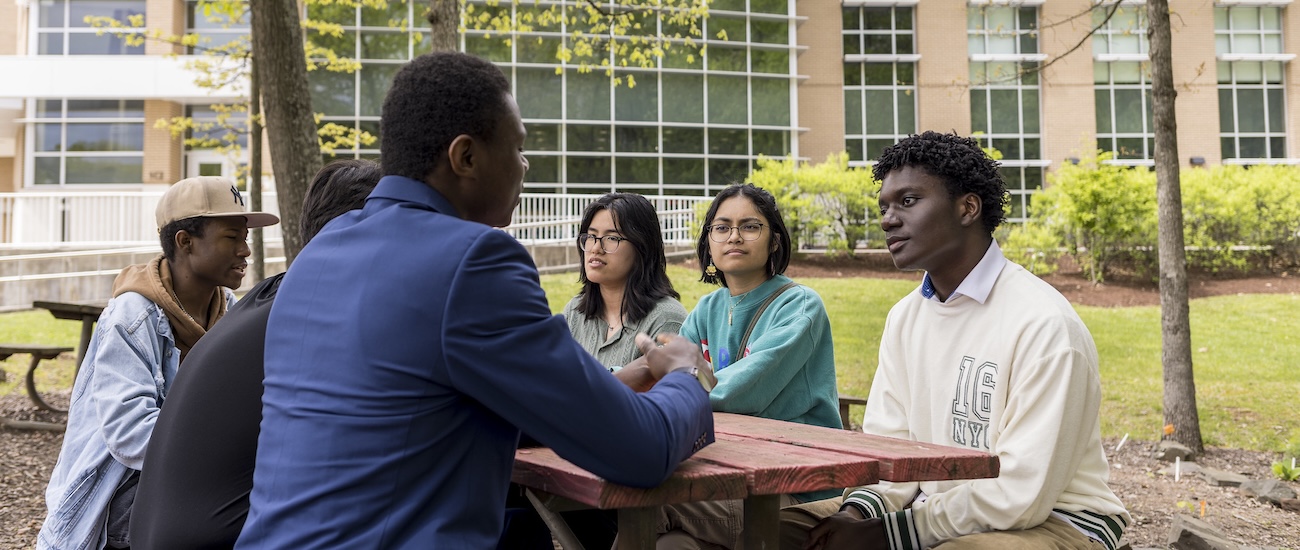 students on a bench working together